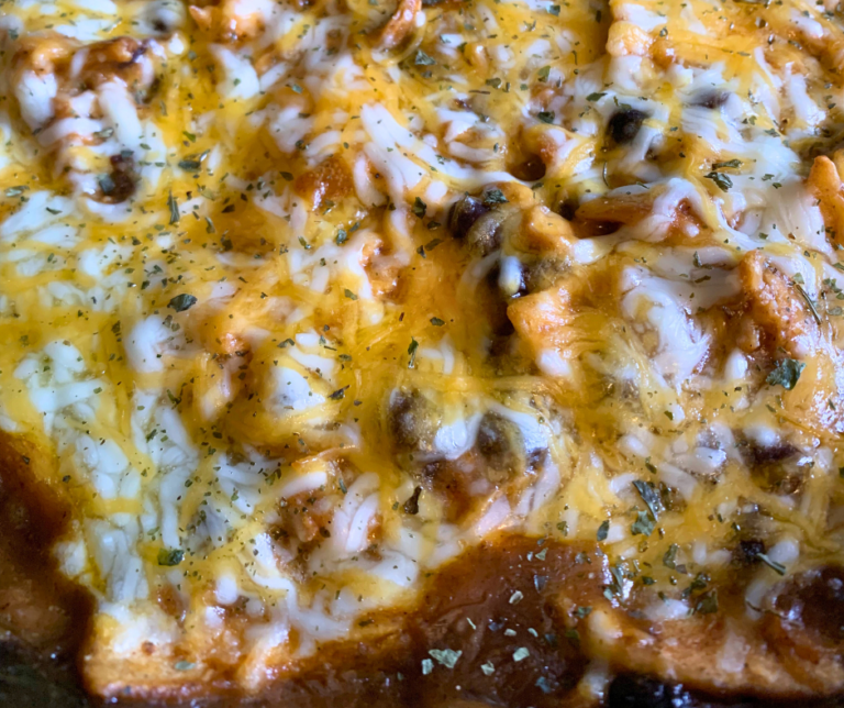 photo of baked one skillet chicken enchiladas