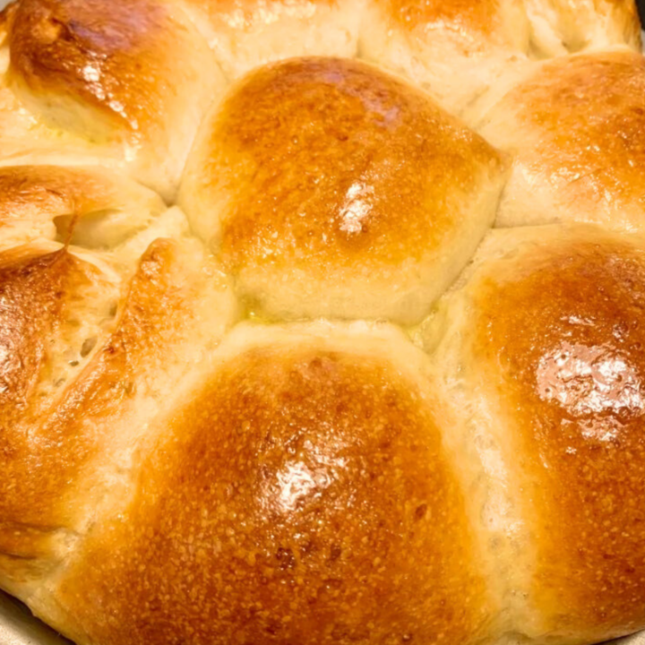 photo of soft and buttery sourdough dinner rolls
