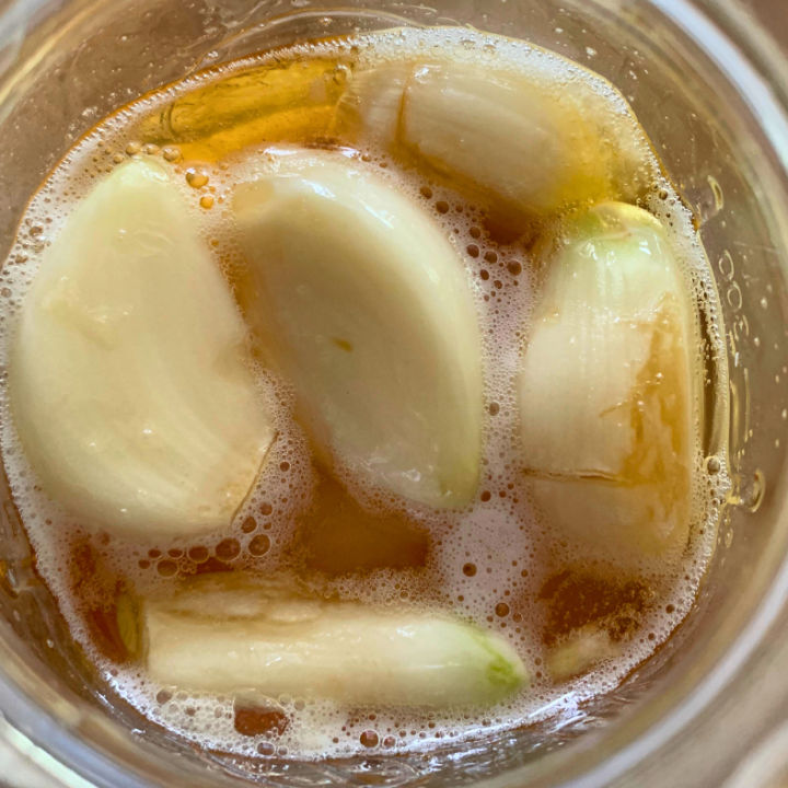 photo of garlic fermenting in honey