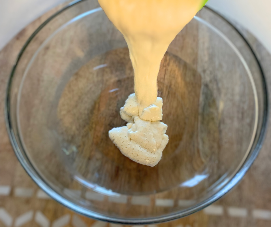 a photo of sourdough starter being poured