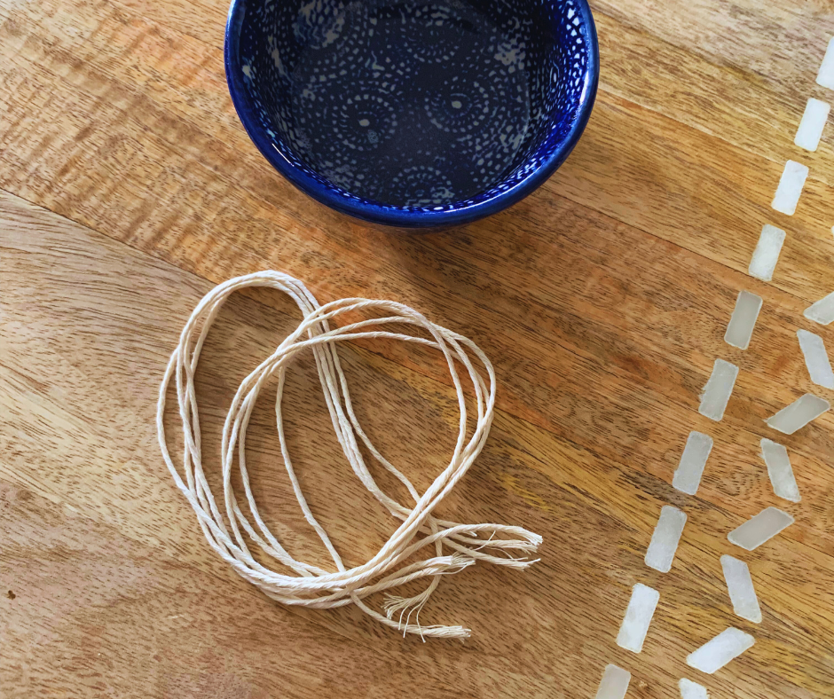 a photo of twine and melted coconut oil in a bowl
